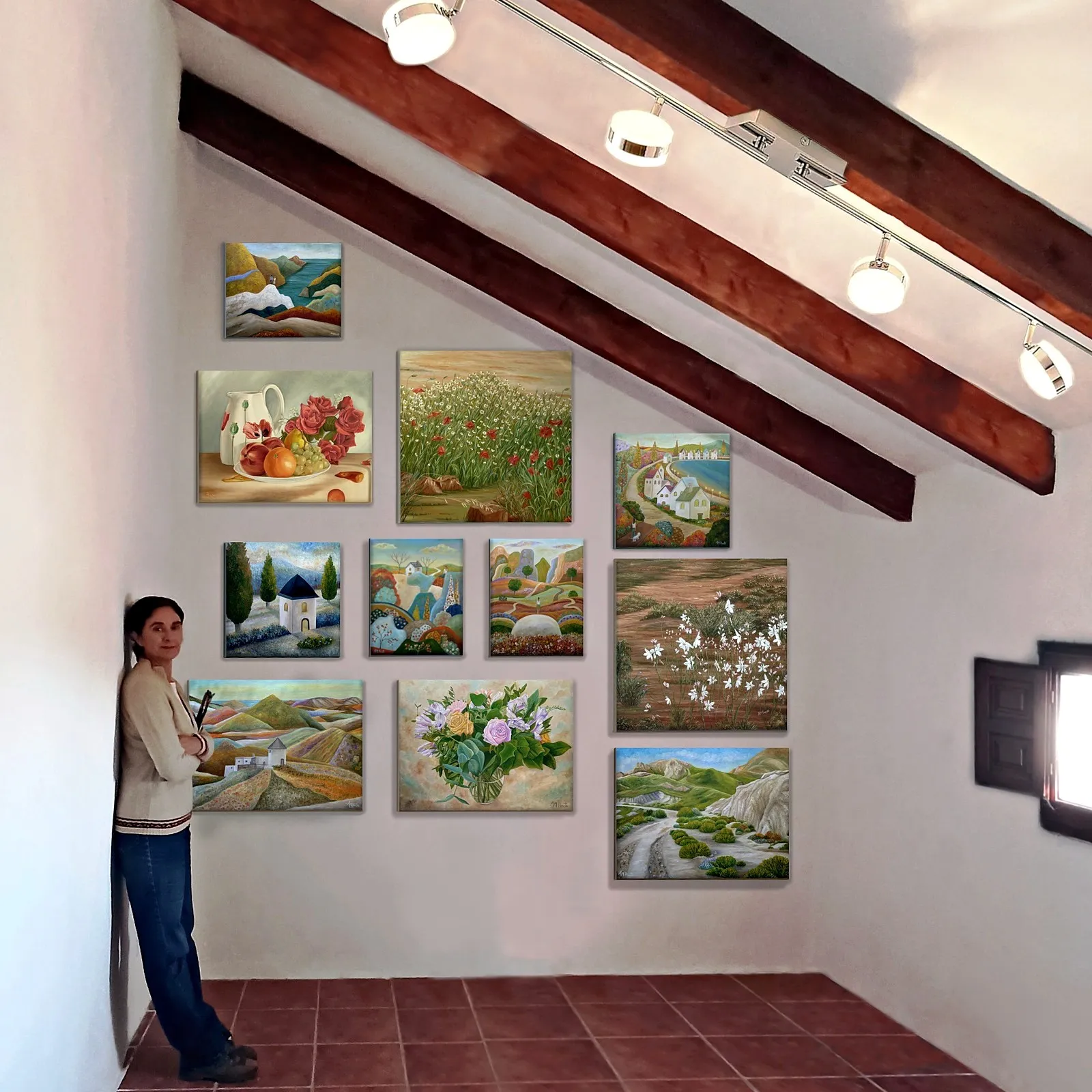 Angeles beside a wall of her paintings